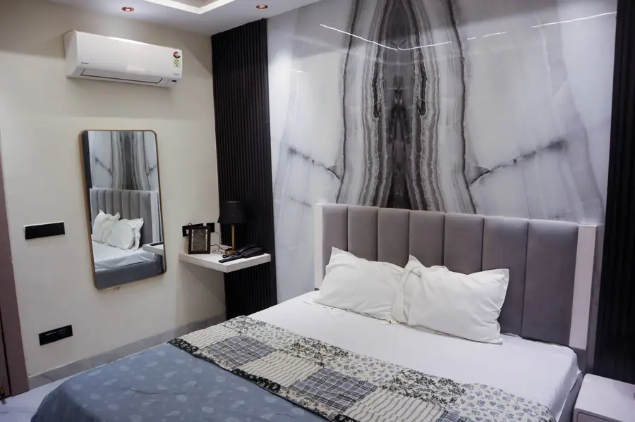 Bedroom with marble accent wall